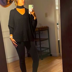 Sleek black top with neck cut out